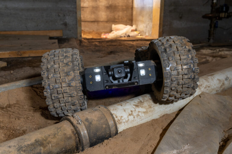 Crawlspace inspection robot traveling beneath a home